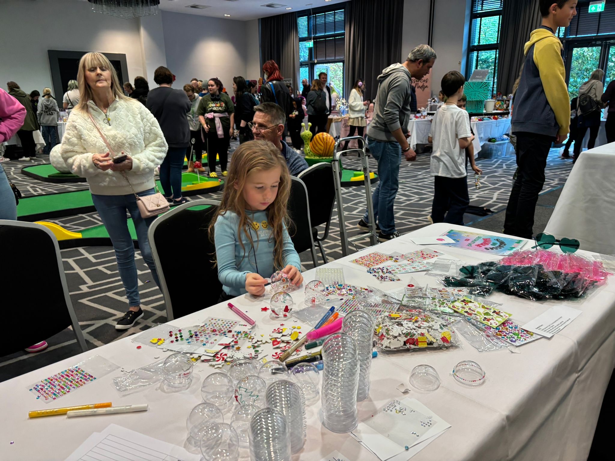 A girl crafting at a table
