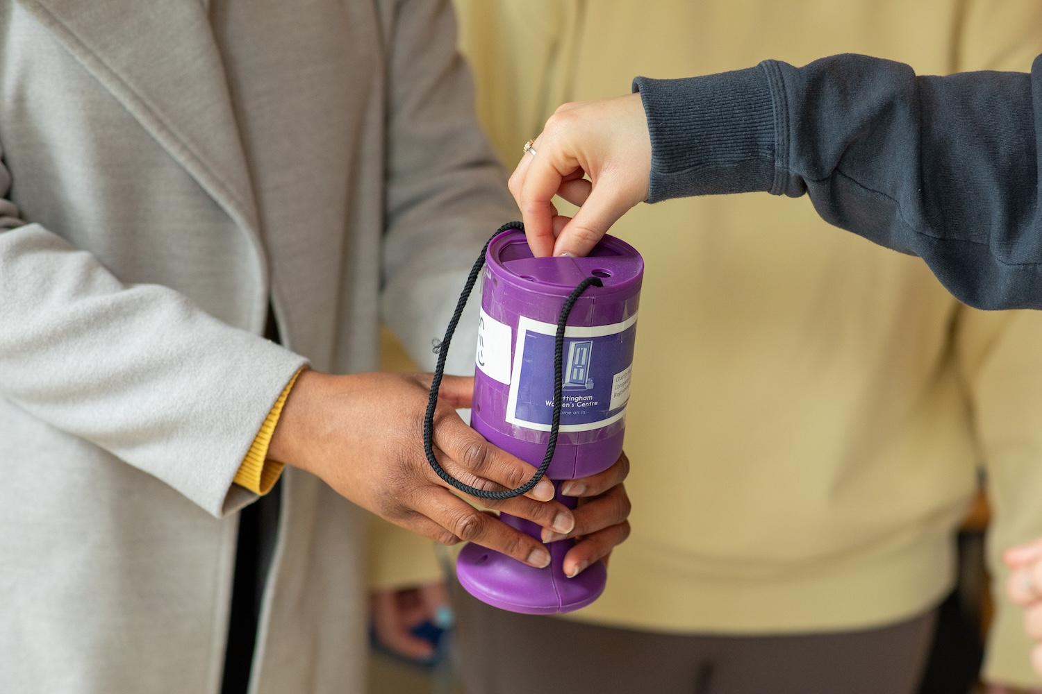 a donation tin at the Nottingham Women's center