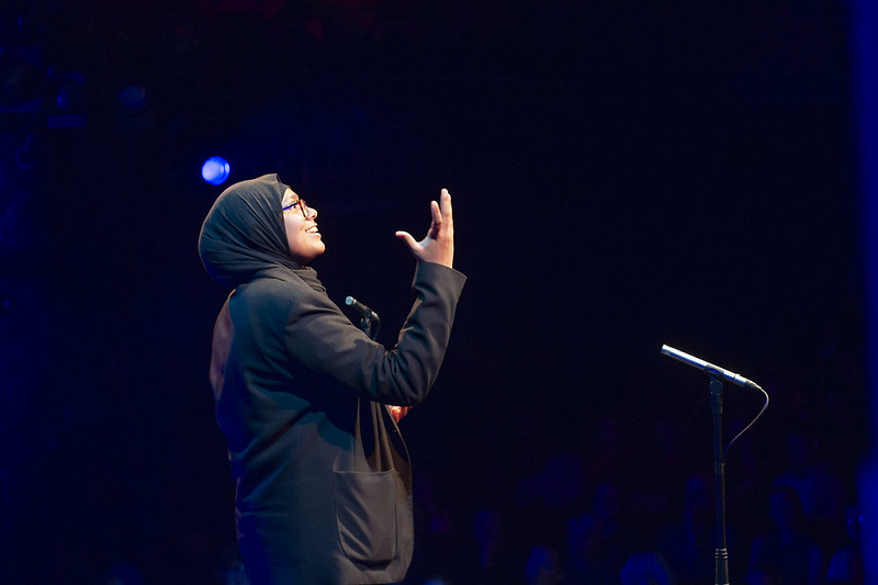 Young person speaking on a stage