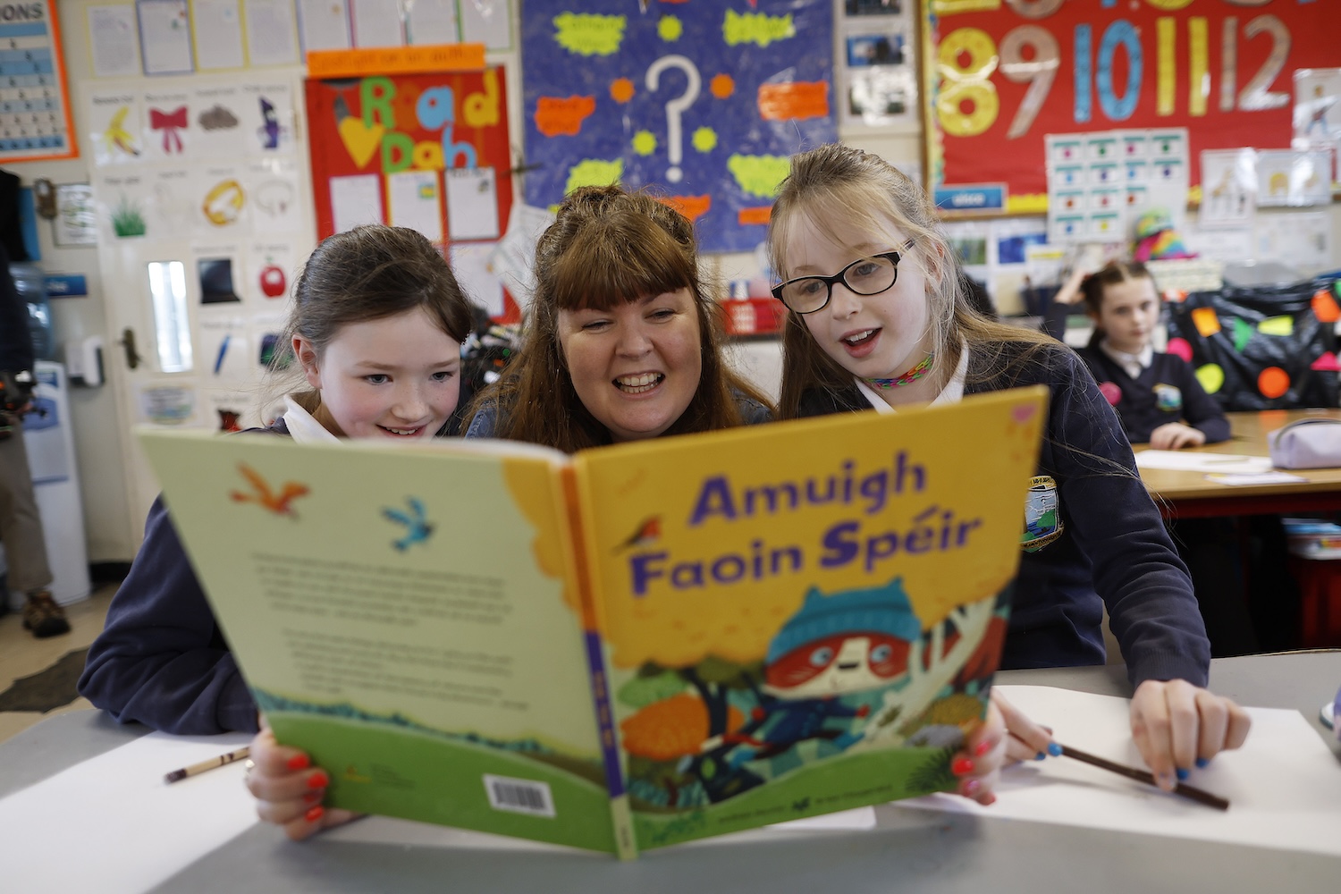 a teacher reading to children